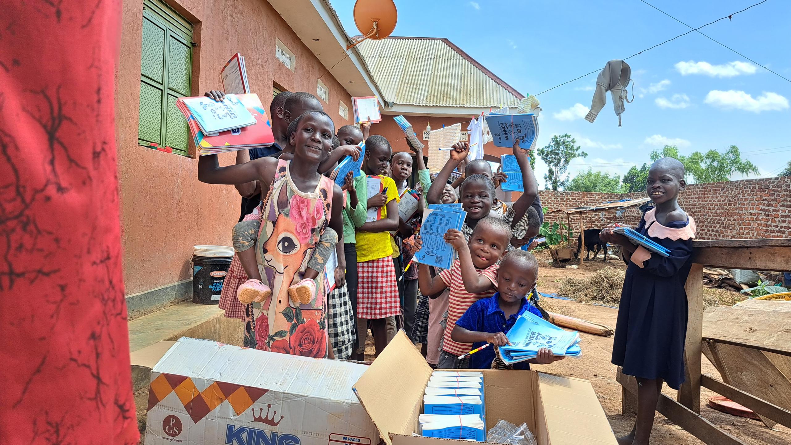 Children celebrating with books