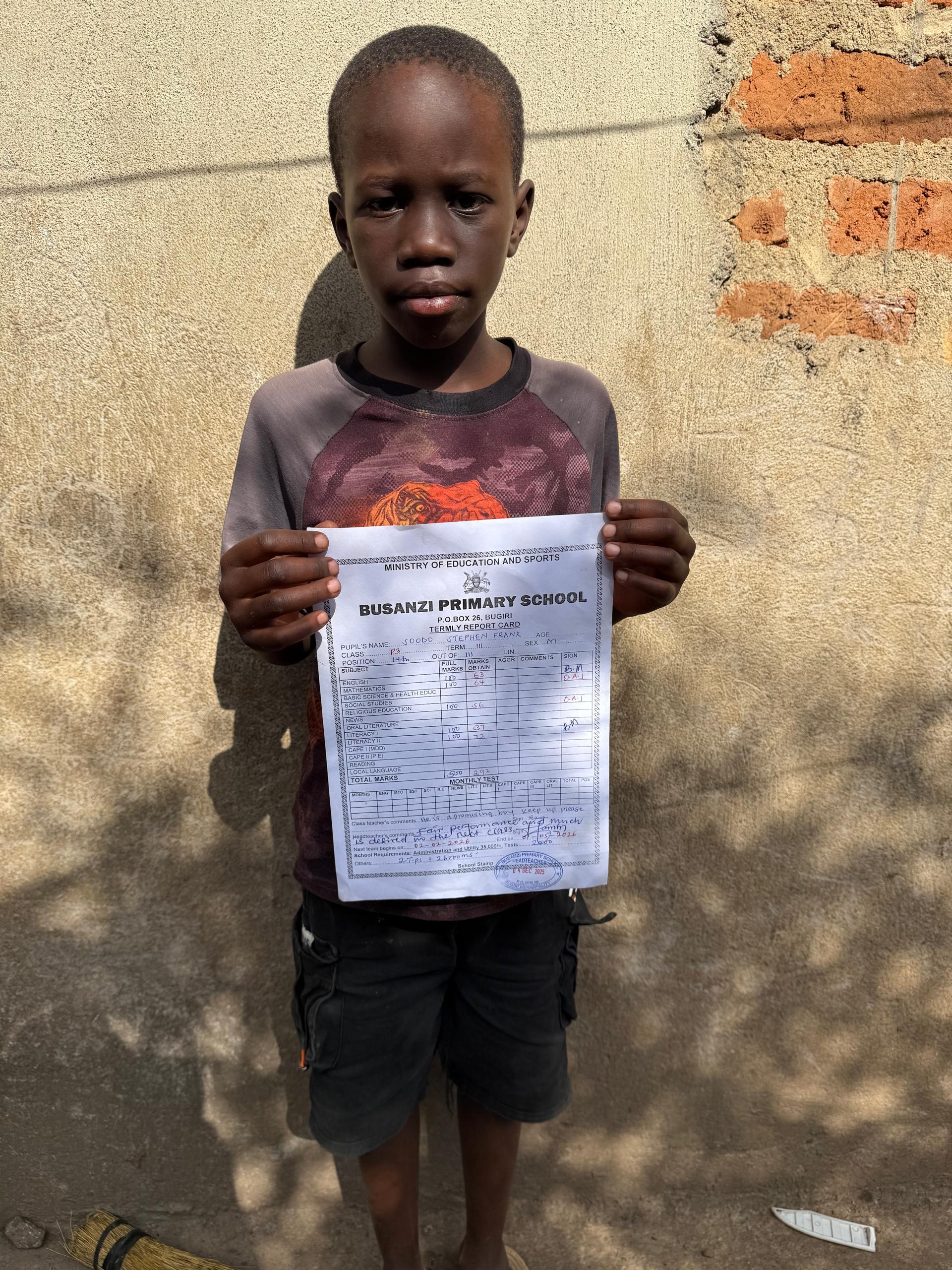 Boy with report card